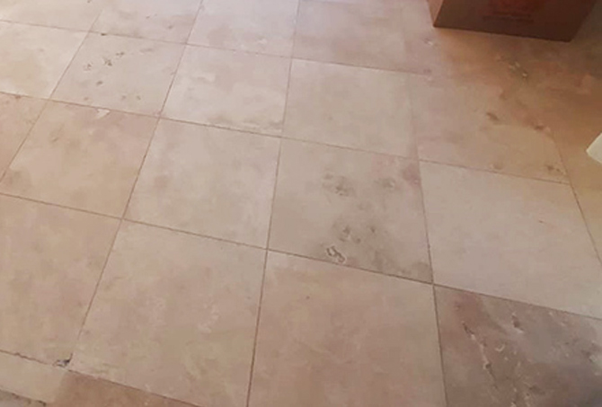 Unsightly, dull travertine finish.