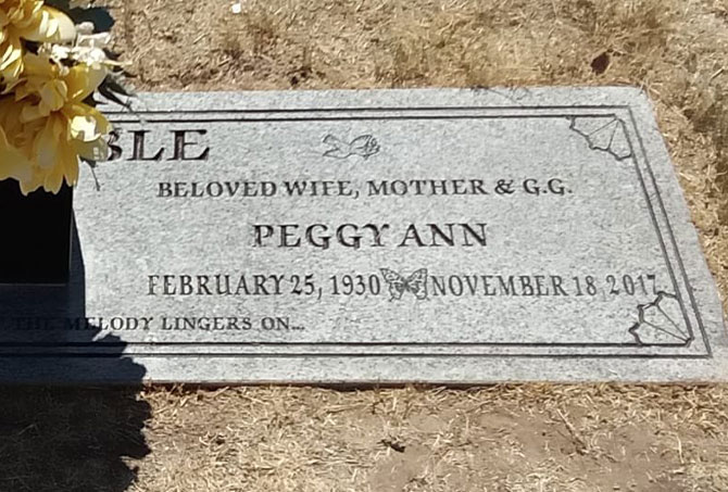 The stains have been removed from a granite headstone.