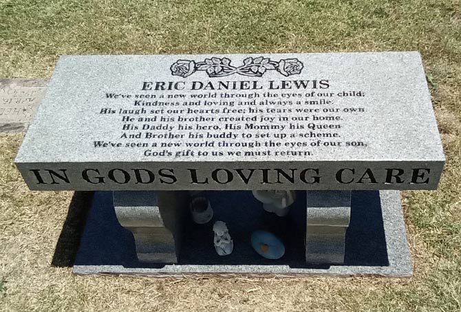 The stains on a granite memorial bench have been removed.