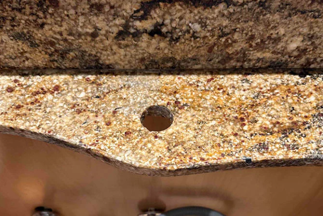 This AFTER image shows the repaired granite countertop.