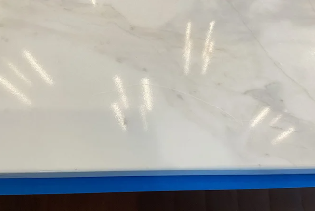 This BEFORE image shows a more significant scratch