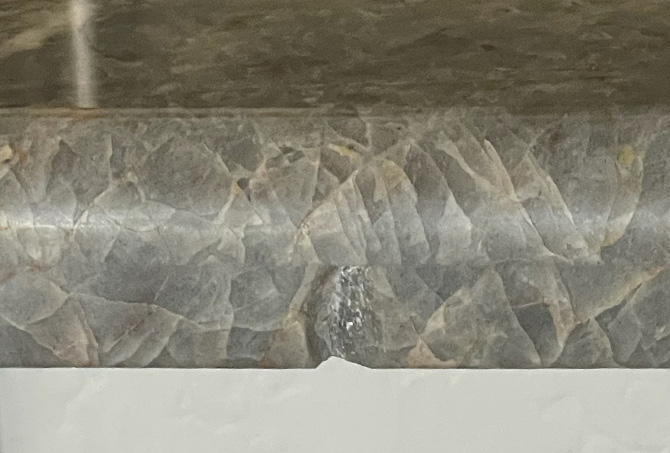 This BEFORE image shows the chipped granite.
