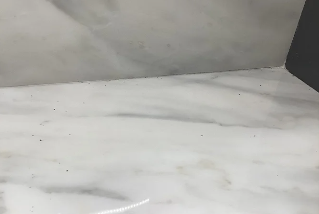 We carefully scraped a bit of paint from the countertop
